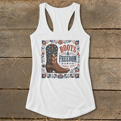 White tank top with Boots & Freedom since 1776 graphic featuring a cowboy boot.