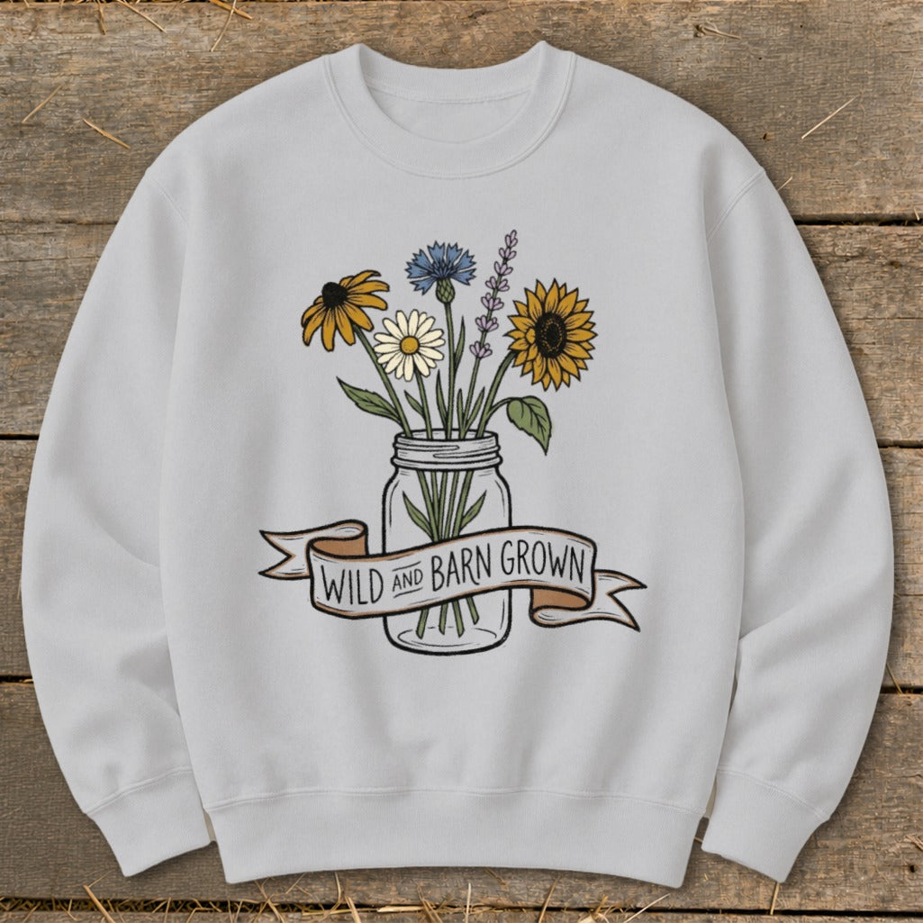 Light gray sweatshirt with a watercolor floral design and "Wild and Barn Grown" banner.