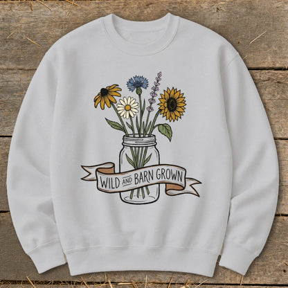 Light gray sweatshirt with a watercolor floral design and "Wild and Barn Grown" banner.