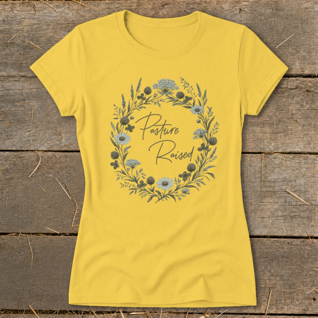 Yellow t-shirt with a floral wreath design and "Pasture Raised" text.