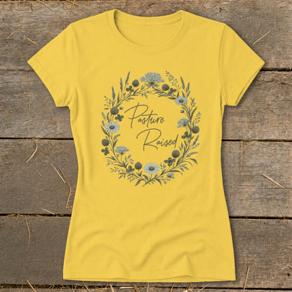 Yellow t-shirt with a floral wreath design and "Pasture Raised" text.