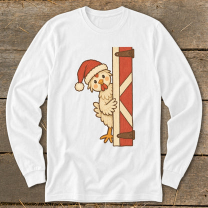 White long sleeve shirt with a cartoon chicken in a Santa hat peeking from behind a barn door.