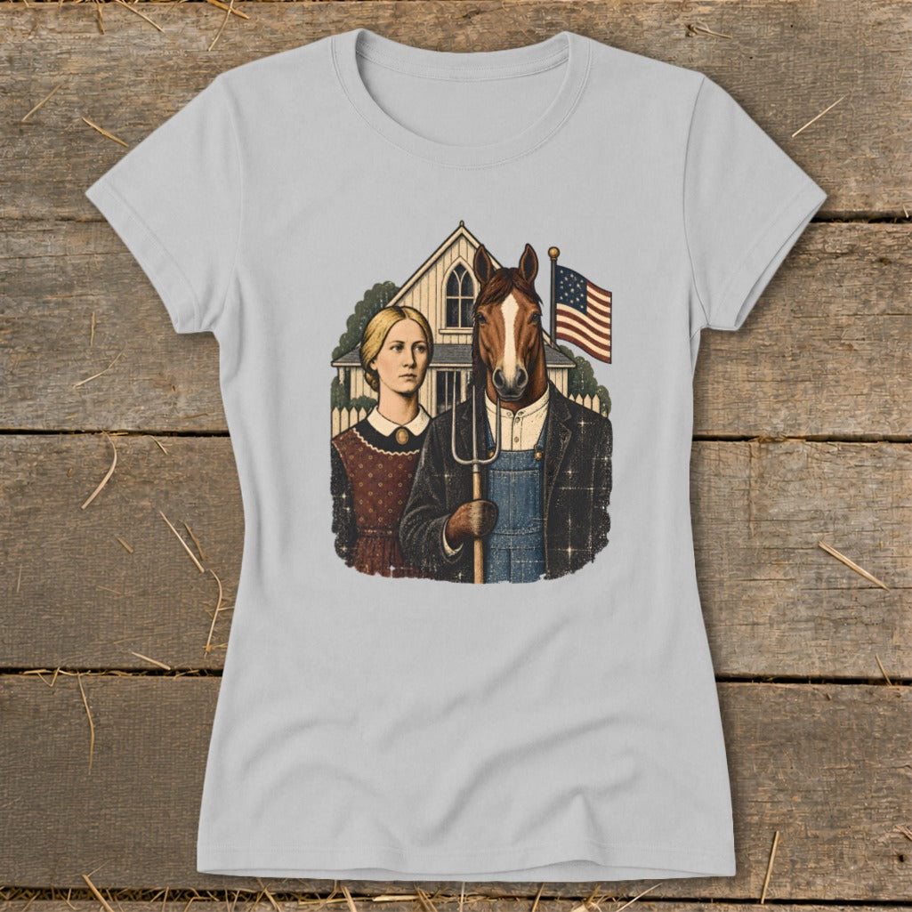 A light gray crewneck t-shirt featuring a parody American Gothic graphic with a horse holding a pitchfork.