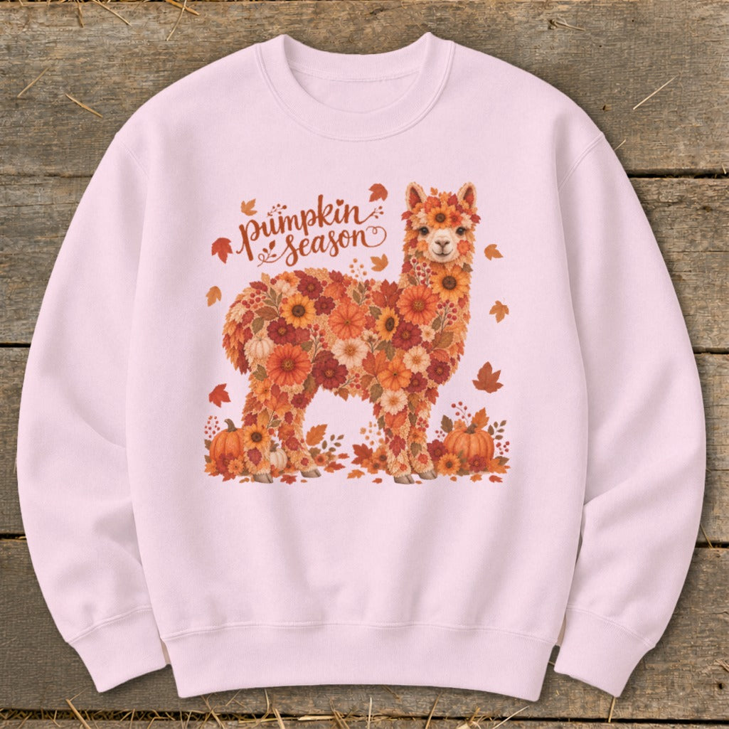 Pink sweatshirt with an alpaca made of flowers and autumn leaves, with "Pumpkin Season" text.