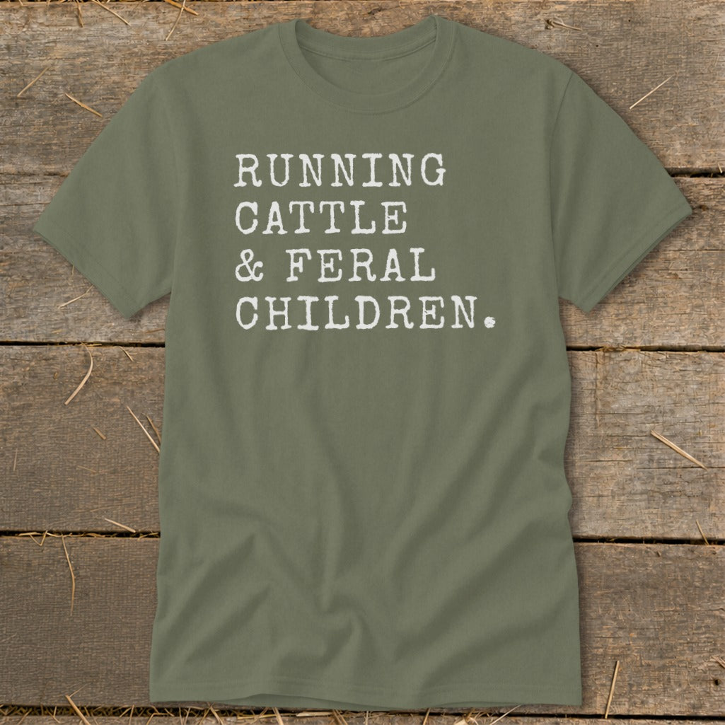 Olive green t-shirt with white text reading "RUNNING CATTLE & FERAL CHILDREN."