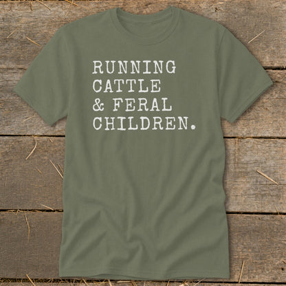 Olive green t-shirt with white text reading "RUNNING CATTLE & FERAL CHILDREN."