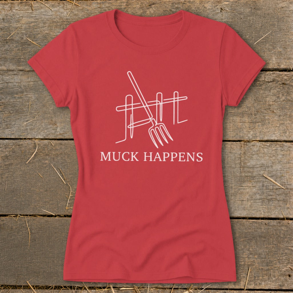 Red t-shirt with white graphic of pitchfork and fence, text "MUCK HAPPENS".