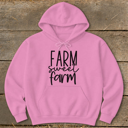 Pink hooded sweatshirt with "Farm sweet farm" text on chest.