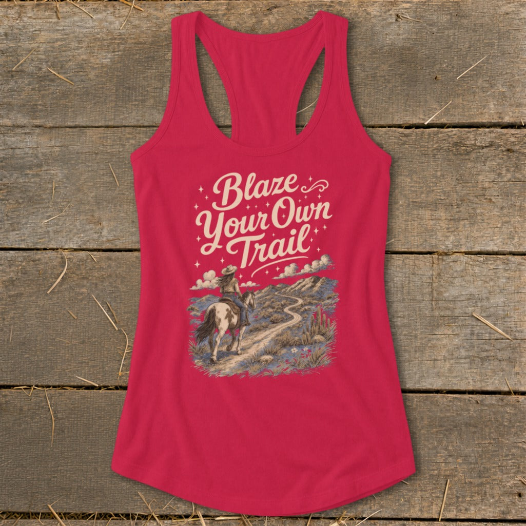 Pink tank top with "Blaze Your Own Trail" text and desert landscape graphic.