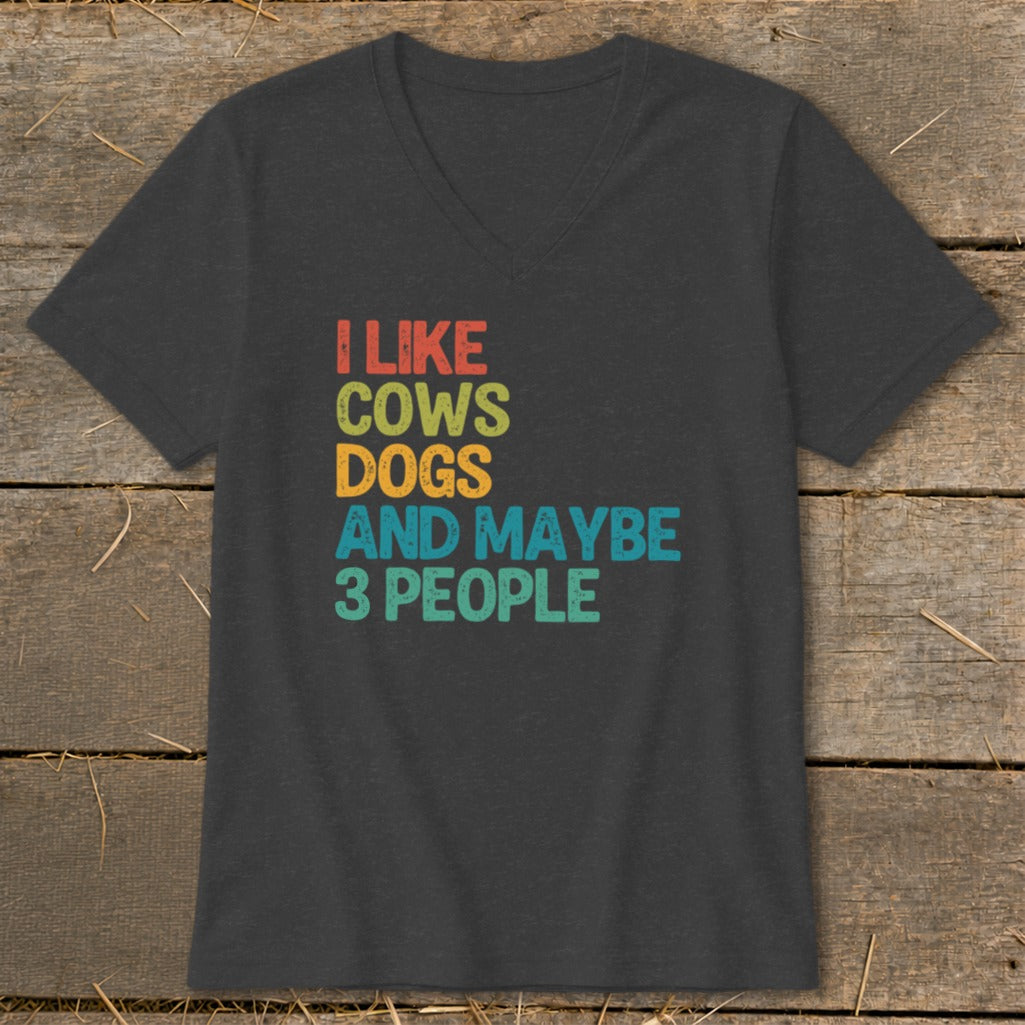 Dark gray v-neck t-shirt with text "I LIKE COWS DOGS AND MAYBE 3 PEOPLE"