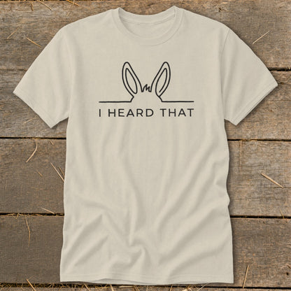 Light tan t-shirt with black line art of donkey ears and text "I HEARD THAT".