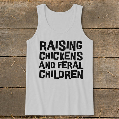 White tank top with black text that reads "RAISING CHICKENS AND FERAL CHILDREN".