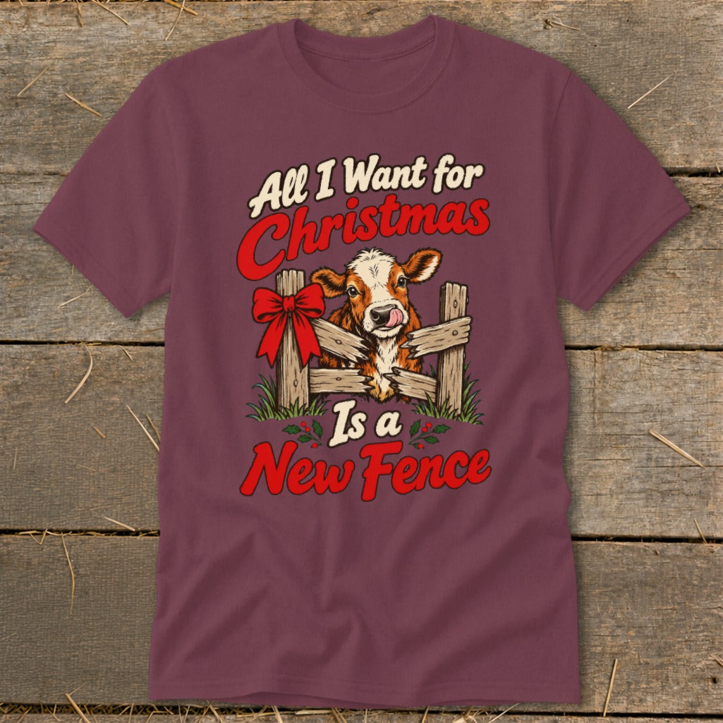Burgundy t-shirt with a calf behind a wooden fence with a bow and text "All I Want for Christmas Is a New Fence."