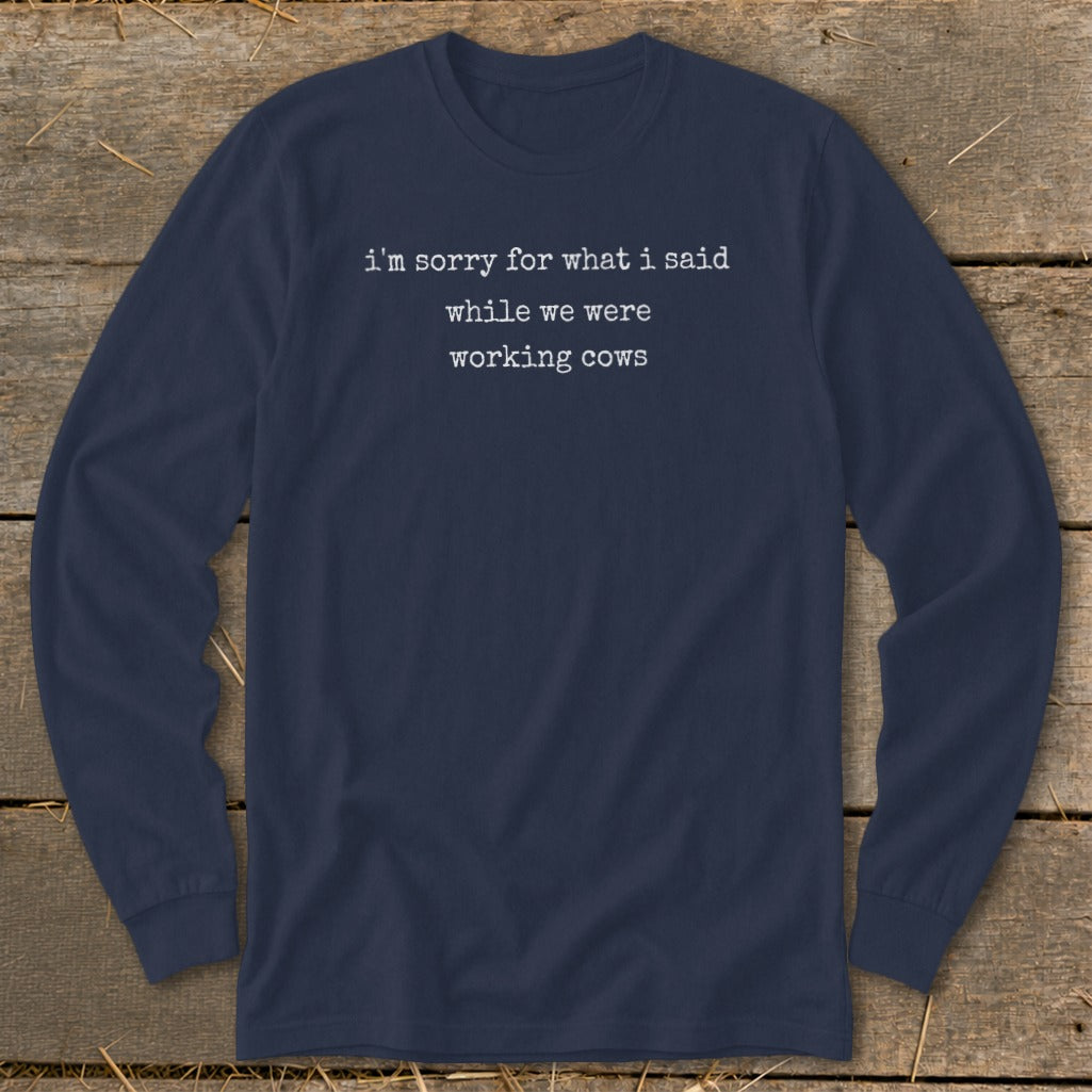 Navy long-sleeve shirt with white text "i'm sorry for what i said while we were working cows."