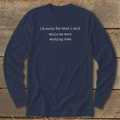 Navy long-sleeve shirt with white text "i'm sorry for what i said while we were working cows."