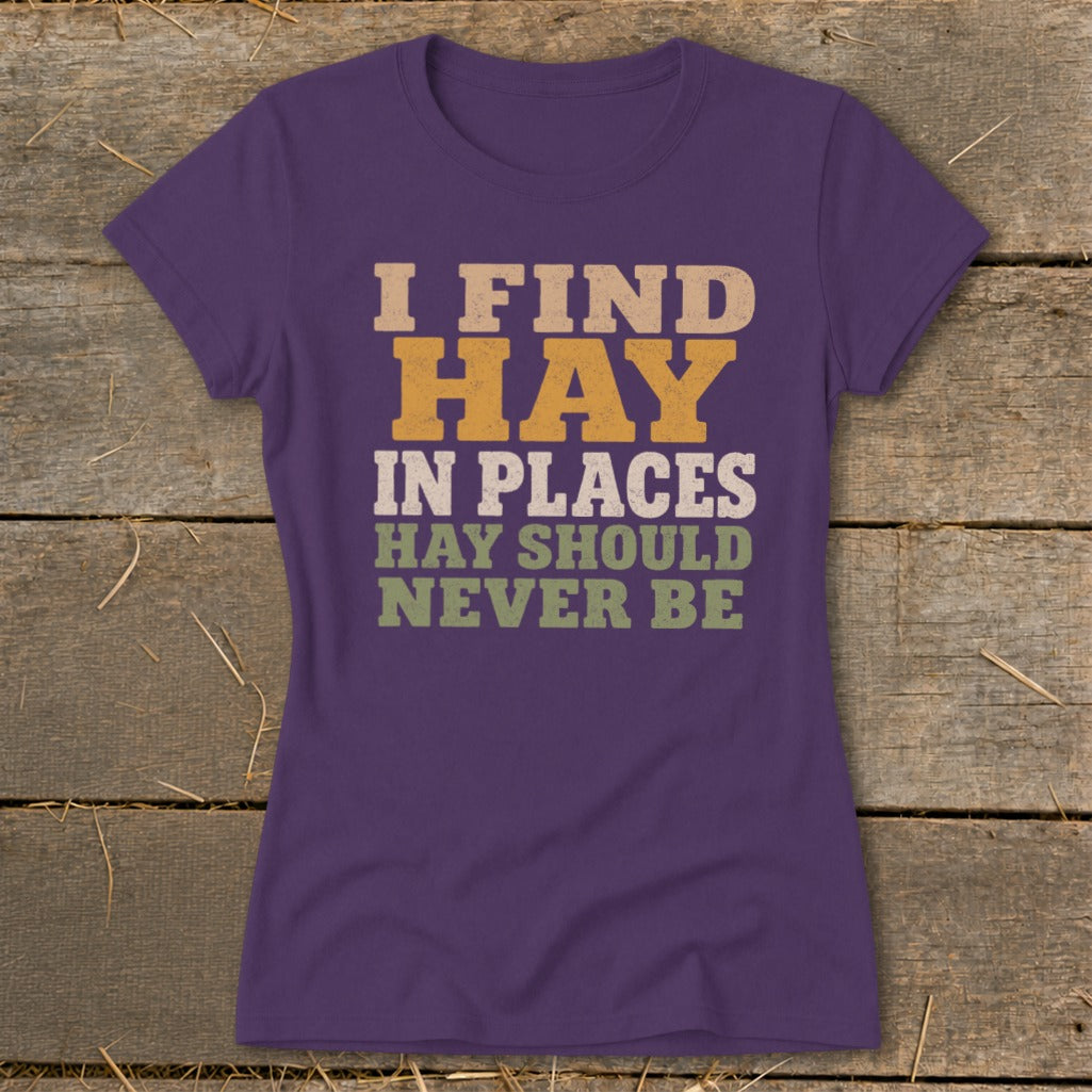 Purple t-shirt with "I FIND HAY IN PLACES HAY SHOULD NEVER BE" text.