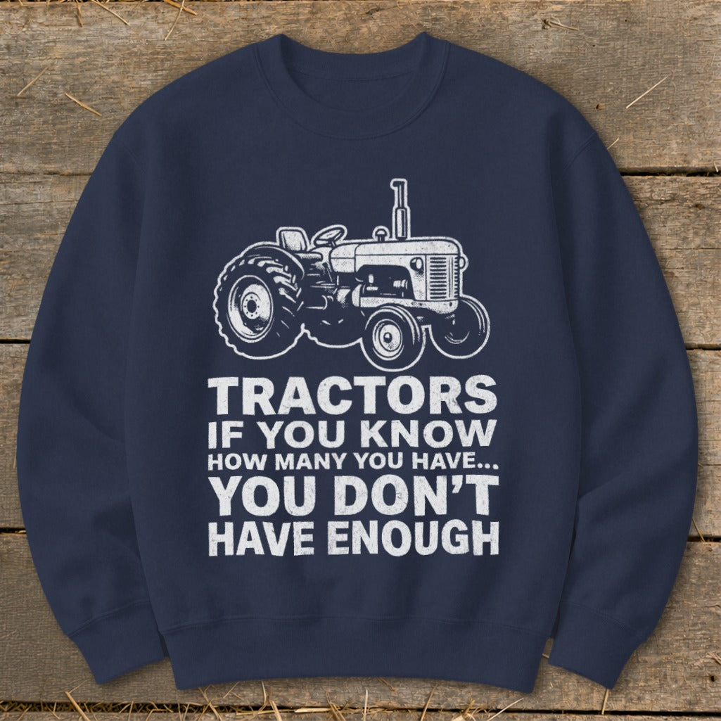Navy sweatshirt with white tractor graphic and text: "Tractors if you know how many you have... you don't have enough."