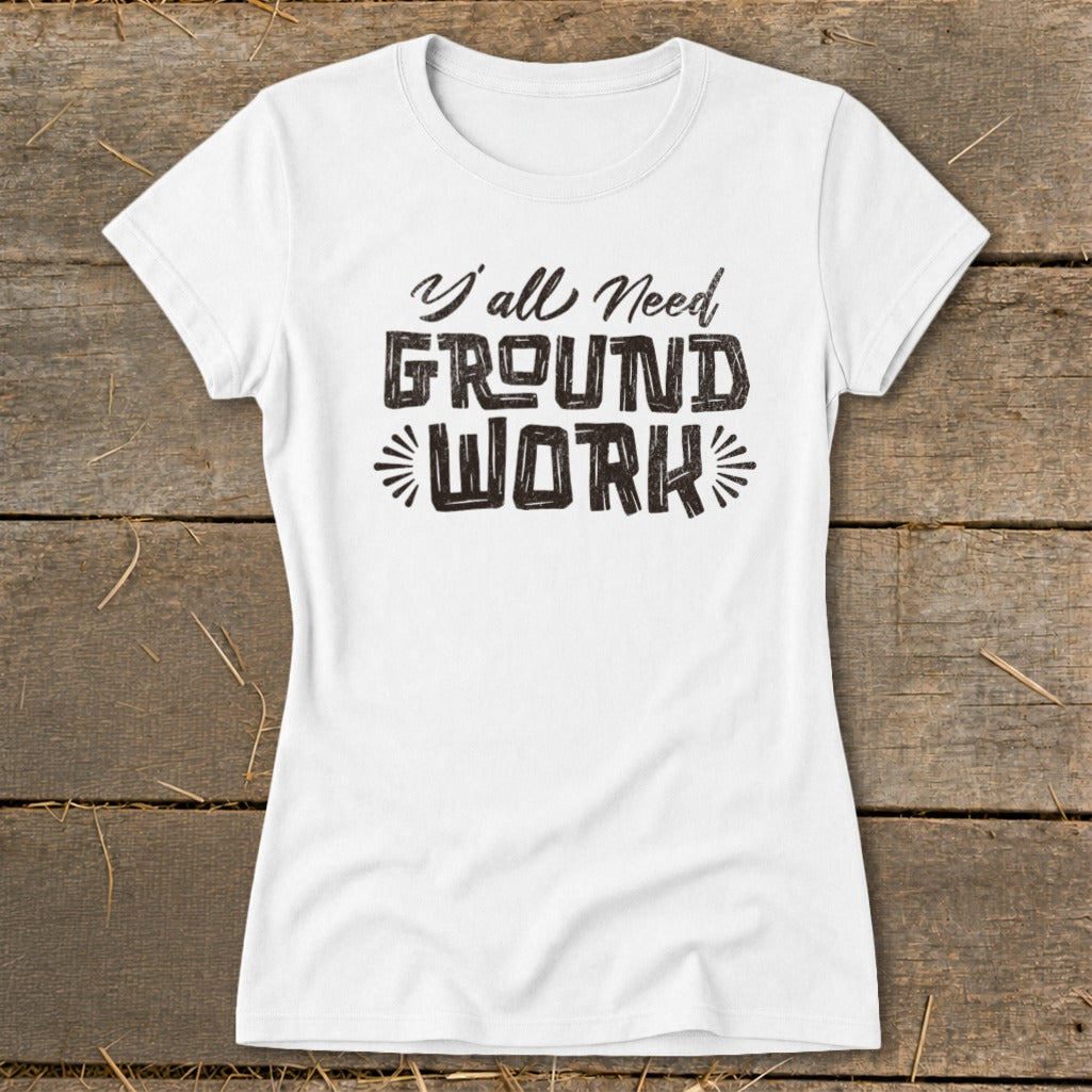 White t-shirt with distressed black text reading "Y'all Need GROUND WORK".
