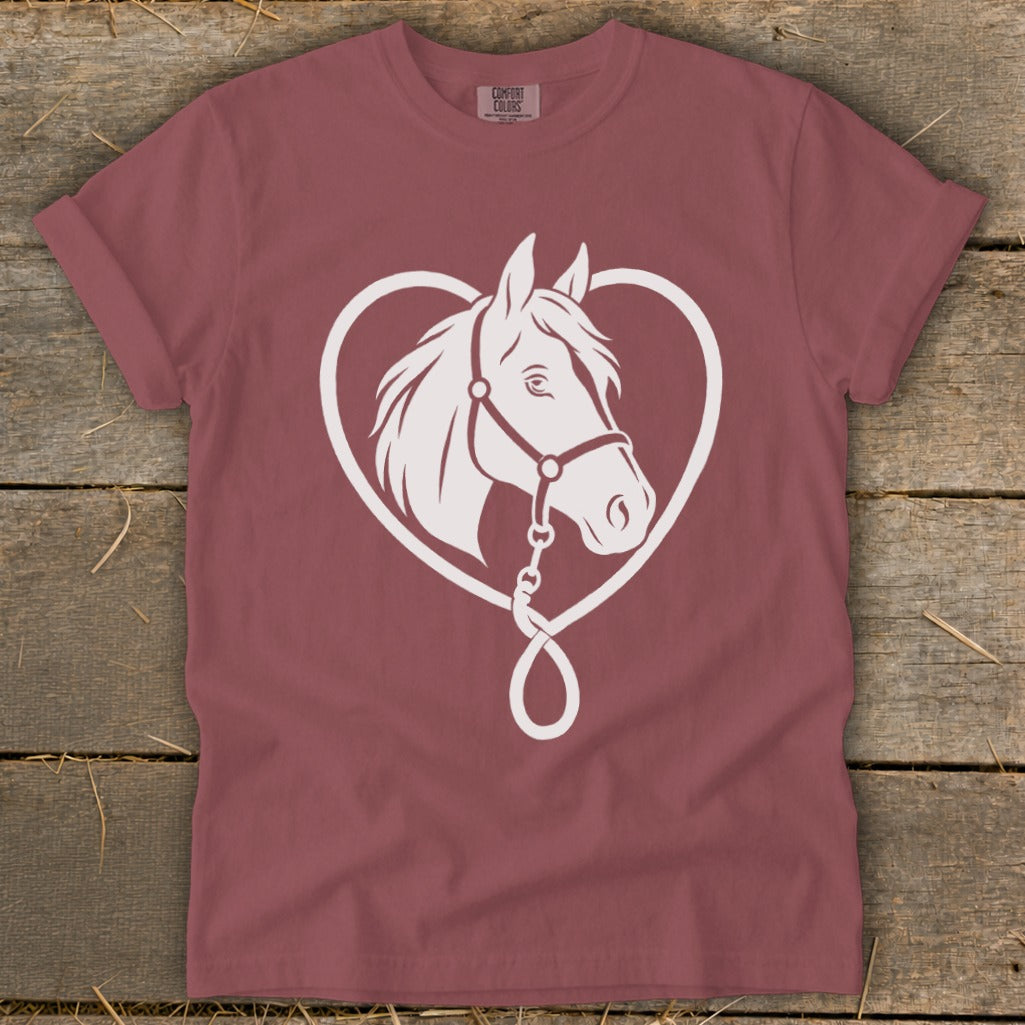 A dusty rose crewneck t-shirt featuring a white graphic of a horse head inside a heart outline.