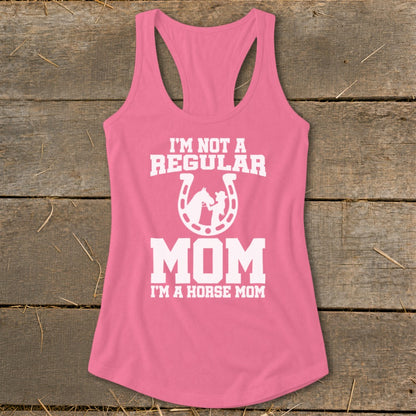 Pink tank top with white text reading "I'M NOT A REGULAR MOM I'M A HORSE MOM".