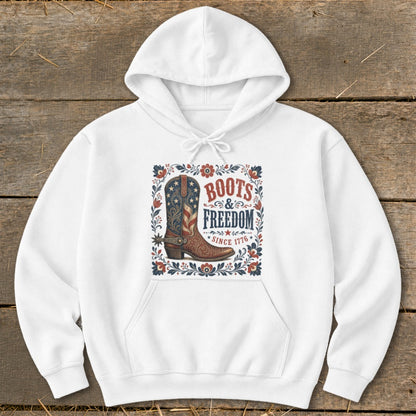 White hoodie with "Boots & Freedom Since 1776" graphic and patriotic cowboy boot.