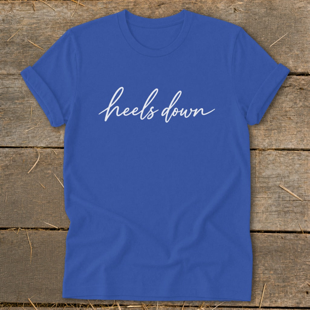 Royal blue t-shirt with "heels down" in white cursive text.