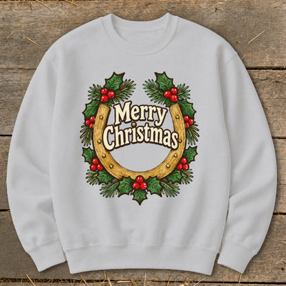 Light grey sweatshirt with "Merry Christmas" inside a horseshoe and holly wreath.