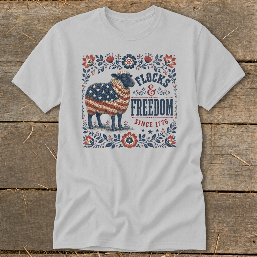 Sheep with American flag wool, "Flocks & Freedom Since 1776" text, floral border.