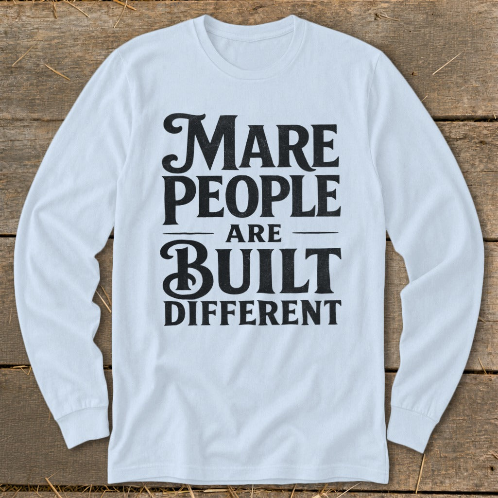 Light blue long-sleeve shirt with black text reading "Mare People Are Built Different".