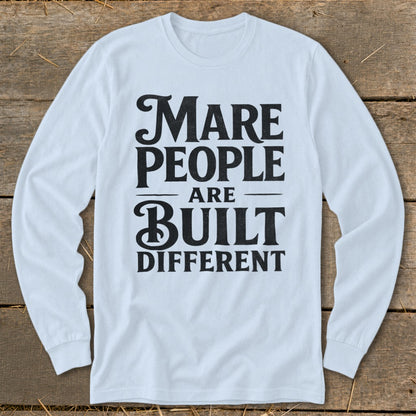 Light blue long-sleeve shirt with black text reading "Mare People Are Built Different".