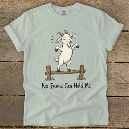 Light blue t-shirt with cartoon goat on fence saying "No Fence Can Hold Me".