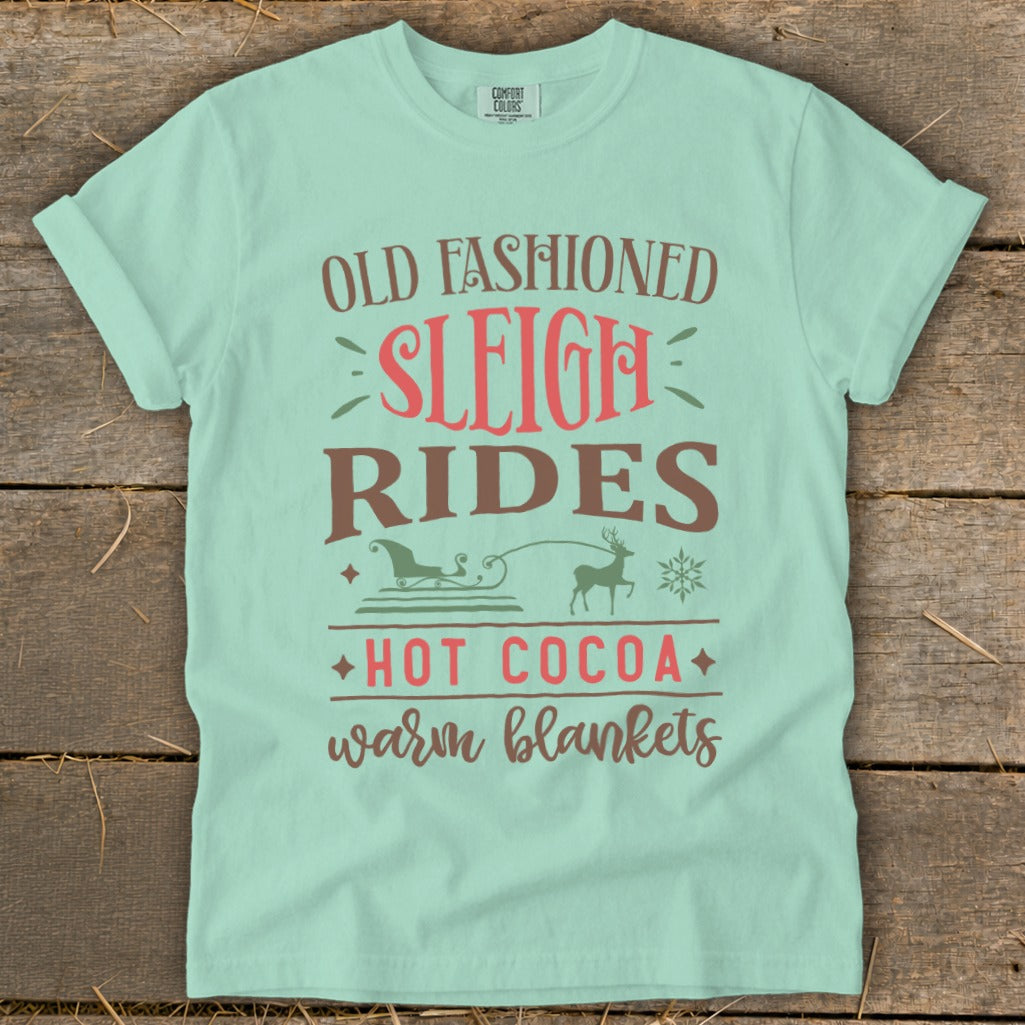 Mint t-shirt with "Old Fashioned Sleigh Rides Hot Cocoa Warm Blankets" text and graphics.