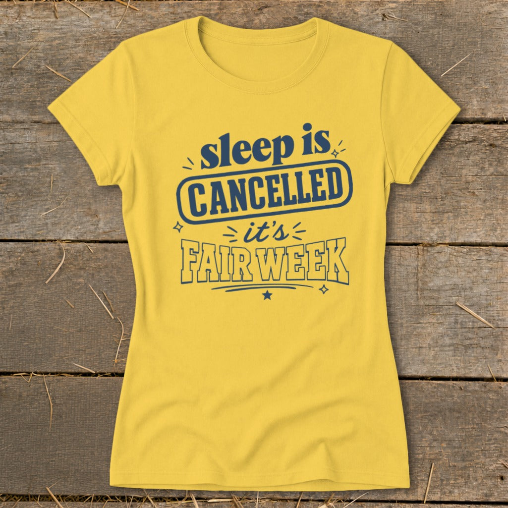 Yellow t-shirt with navy blue text reading "sleep is CANCELLED it's FAIR WEEK".