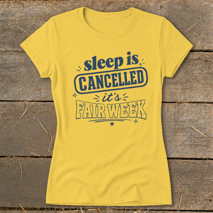 Yellow t-shirt with navy blue text reading "sleep is CANCELLED it's FAIR WEEK".