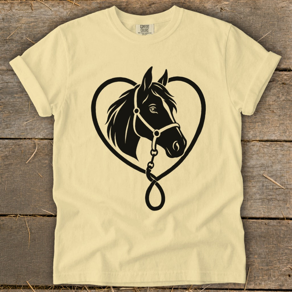 A cream-colored t-shirt with a black graphic of a horse head inside a heart outline.