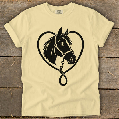 A cream-colored t-shirt with a black graphic of a horse head inside a heart outline.