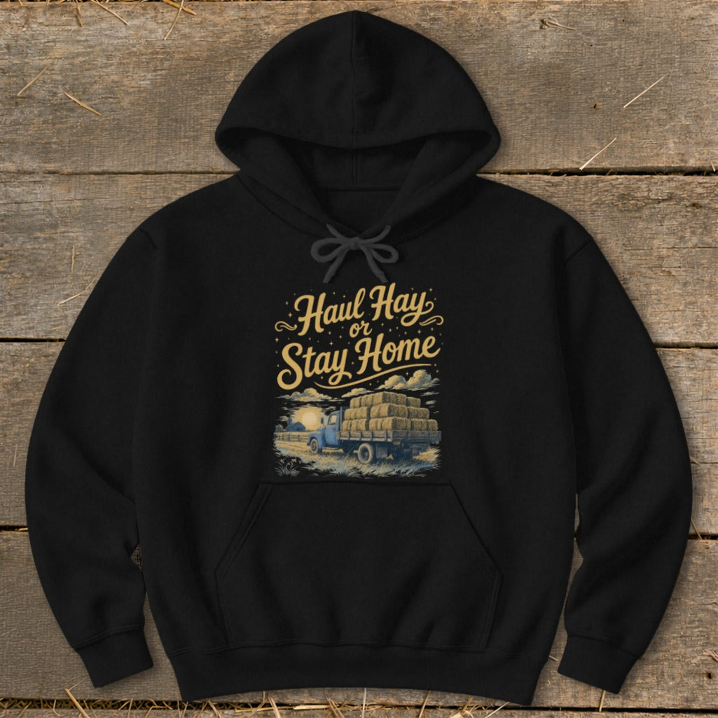 Black hoodie with "Haul Hay or Stay Home" text and a hay-laden truck graphic.