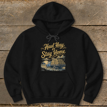 Black hoodie with "Haul Hay or Stay Home" text and a hay-laden truck graphic.