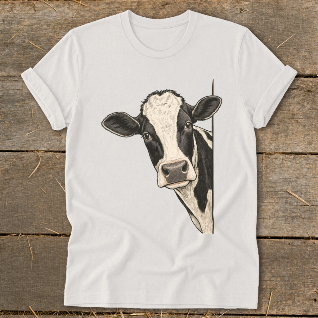 White t-shirt with a black and white cow peeking from the side.