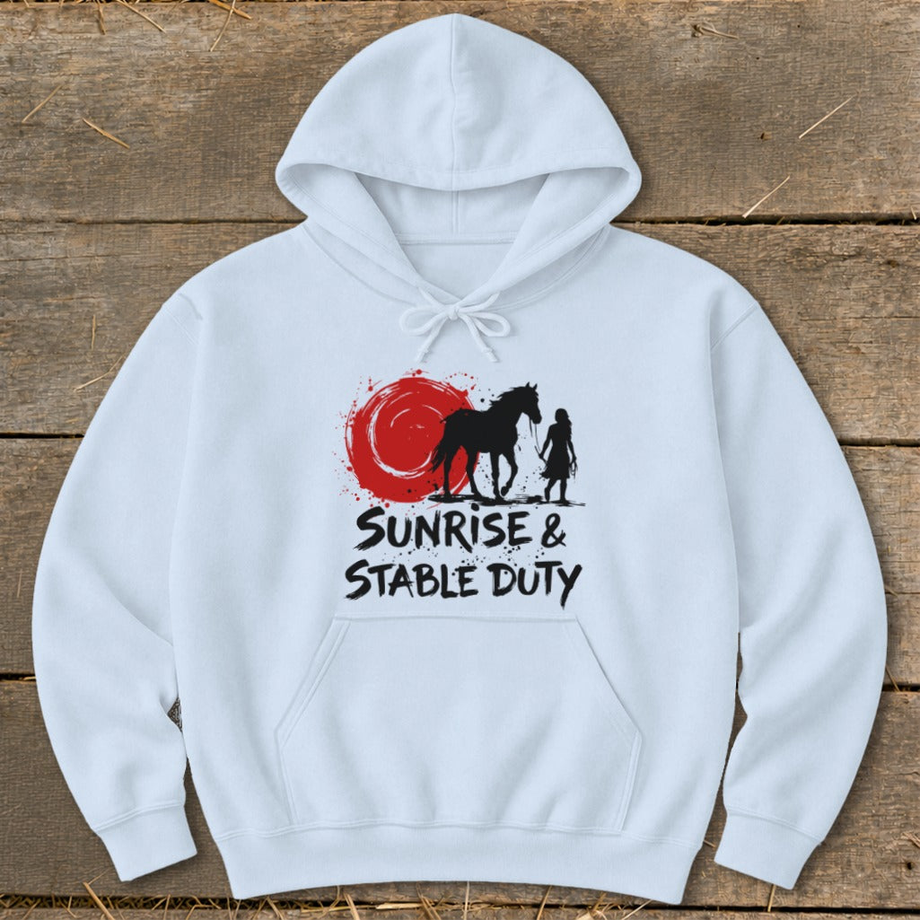 White hoodie with black graphic of horse and rider, red sun, and text "Sunrise & Stable Duty".
