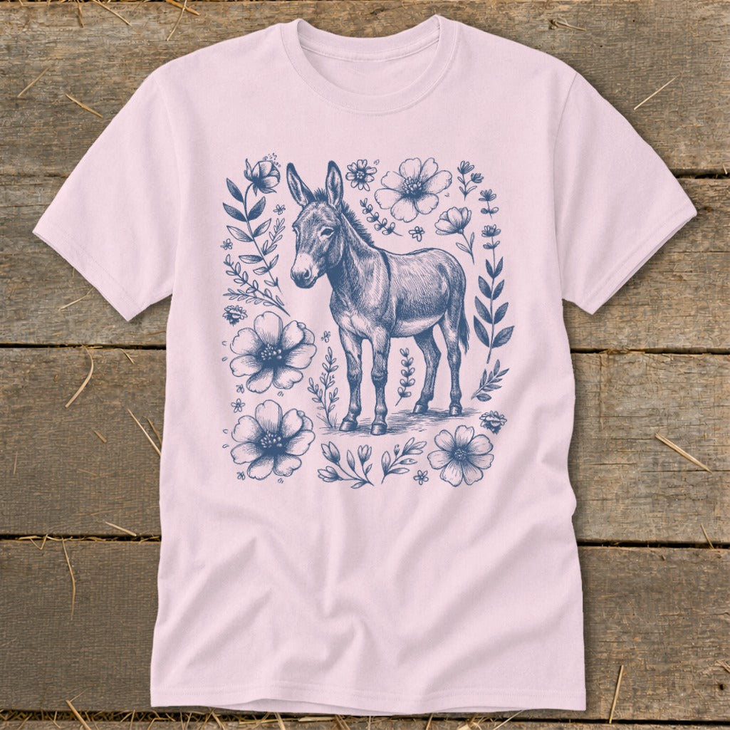 Pink t-shirt with a dark blue sketch of a donkey surrounded by flowers.