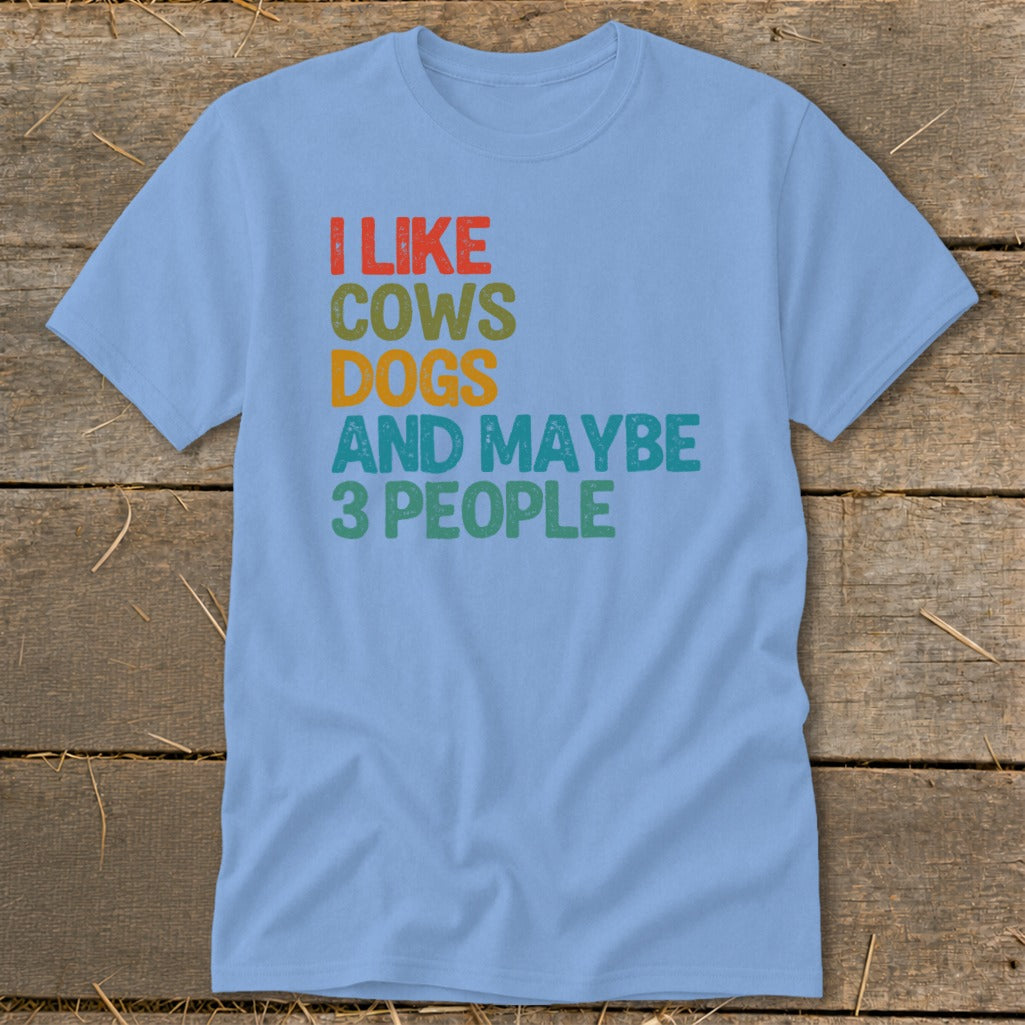 Light blue t-shirt with text "I LIKE COWS DOGS AND MAYBE 3 PEOPLE".