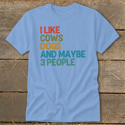 Light blue t-shirt with text "I LIKE COWS DOGS AND MAYBE 3 PEOPLE".