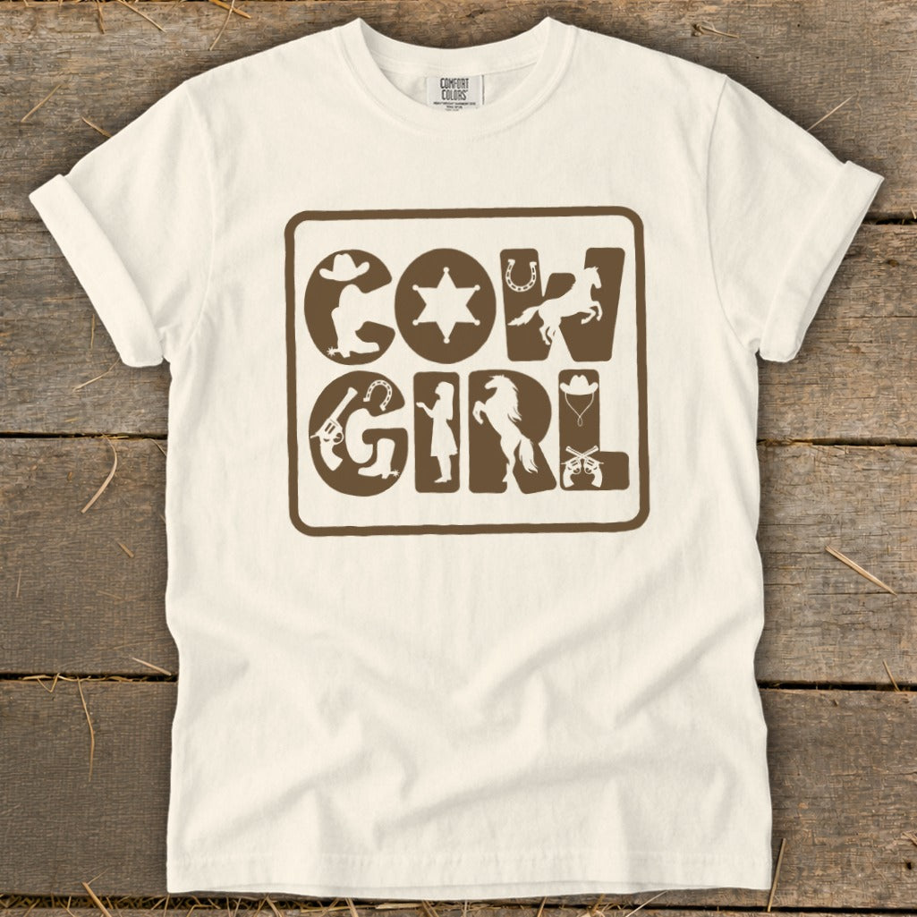Cream t-shirt with brown "Cow Girl" graphic featuring Western-themed icons.