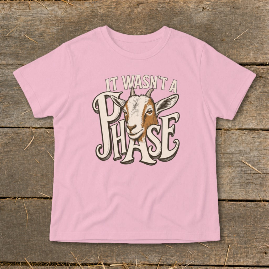 Pink t-shirt with a goat illustration and text "It Wasn't a Phase".