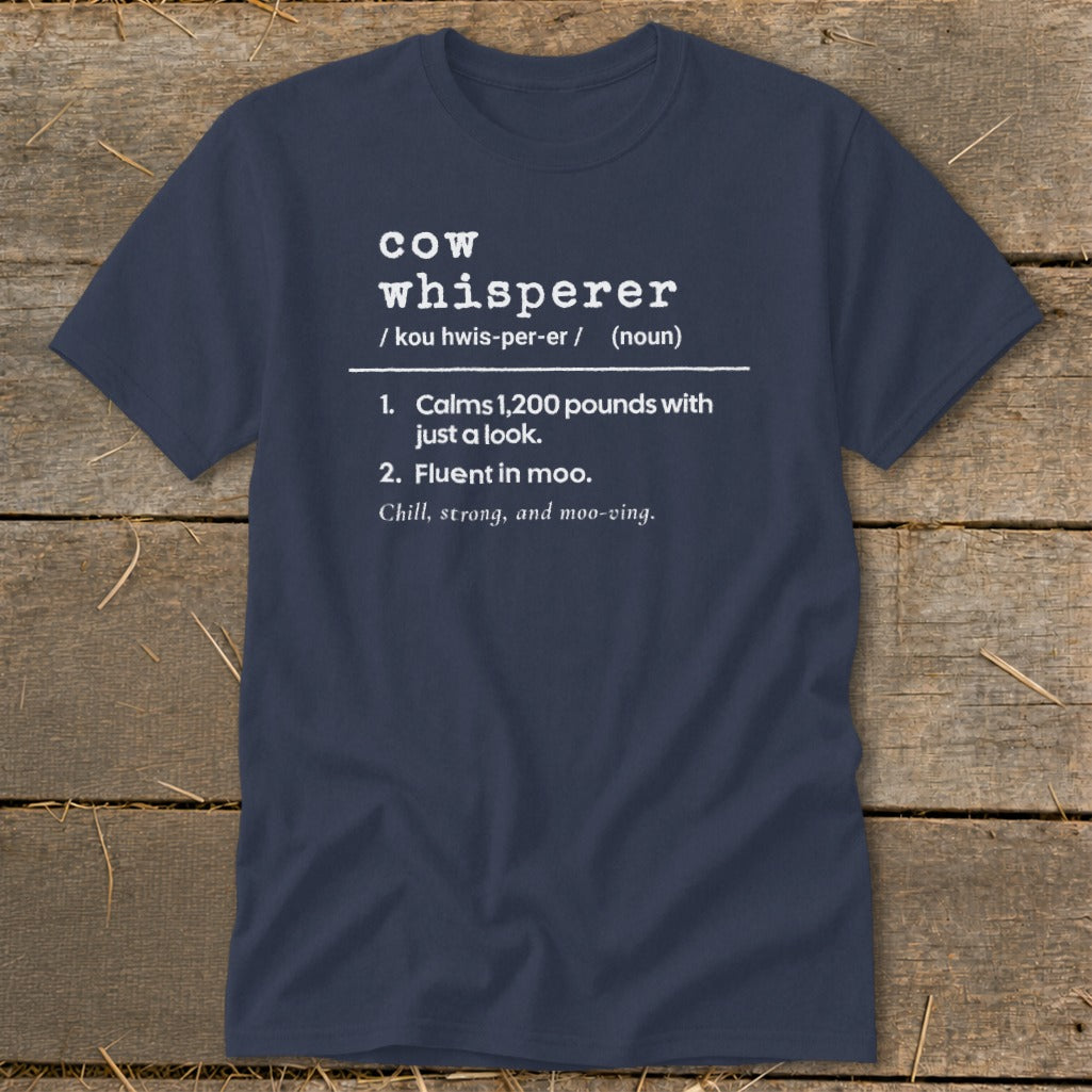 Navy t-shirt with "cow whisperer" definition: calms 1,200 pounds, fluent in moo.