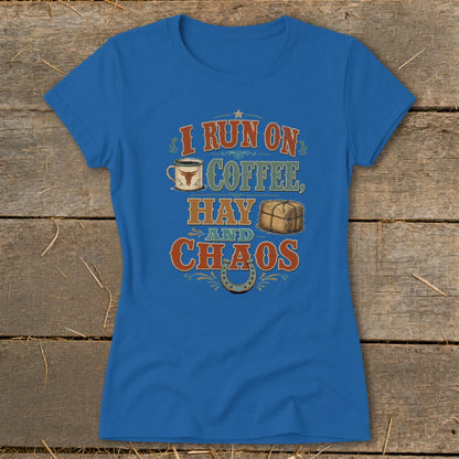 Blue t-shirt with text "I run on coffee, hay and chaos" and graphics.