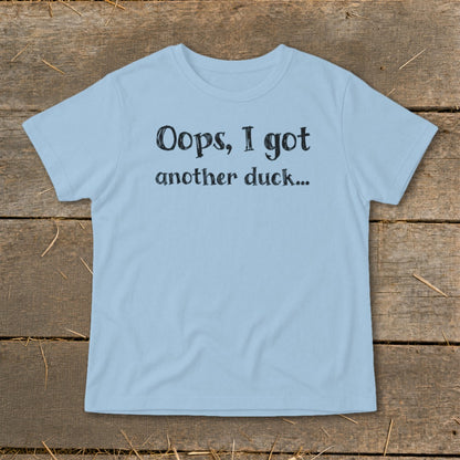 Light blue t-shirt with black text that reads "Oops, I got another duck..."