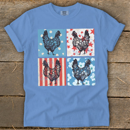 Blue t-shirt with four square panels featuring decorative chickens.