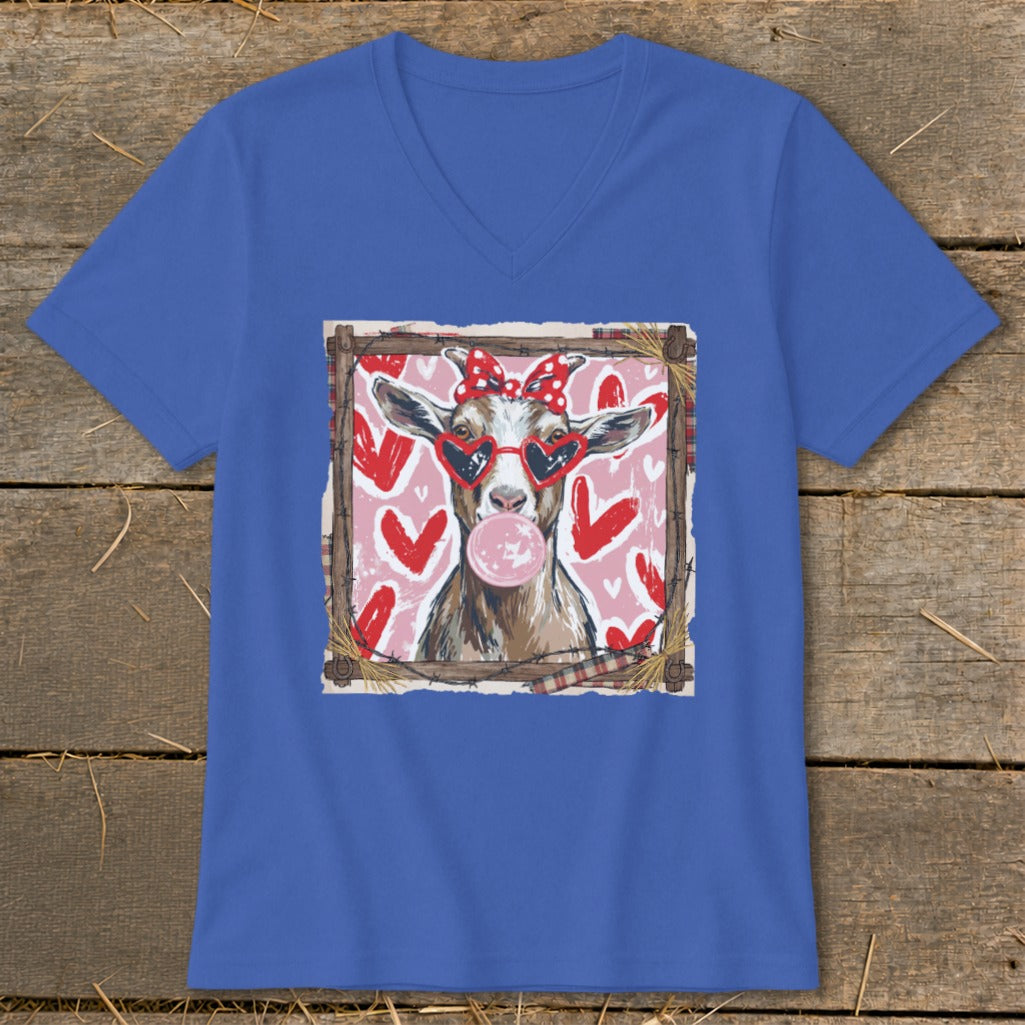 Goat wearing heart sunglasses and polka dot bow, blowing bubblegum on pink background with hearts.